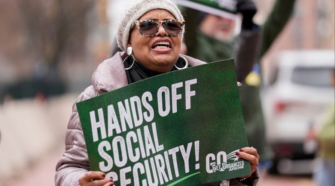 Demonstrators gather outside of the Edward A. Garmatz United States District Courthouse in Baltimore, on Friday, March 14, 2025, before a hearing regarding the Department of Government Efficiency's access to Social Security data. (AP/Stephanie Scarbrough)