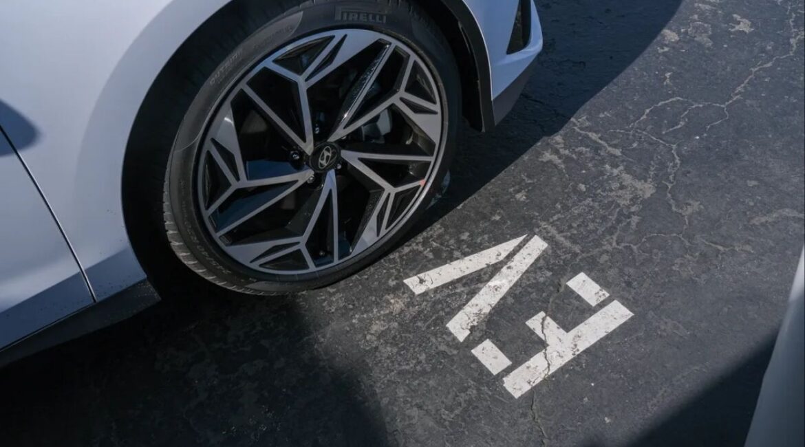 A Hyundai Ioniq 6 at an Electrify America charging station in Oakland on Feb. 27, 2024. (CalMatters/Camille Cohen)