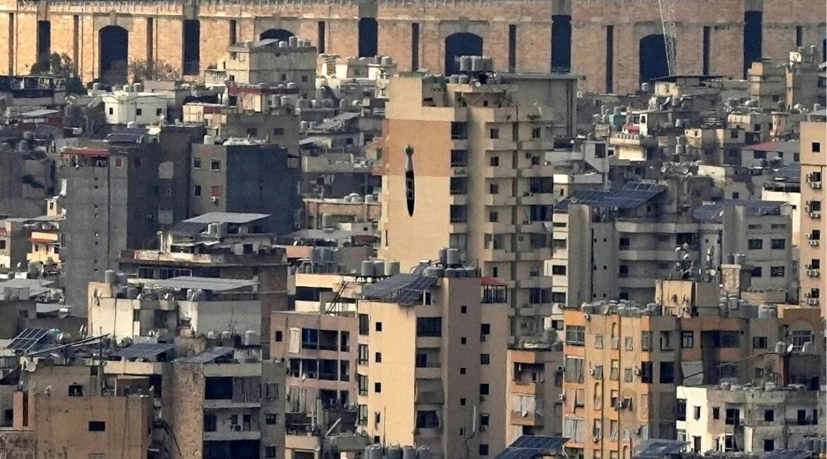 A bomb dropped from an Israeli jet falls before hitting a building in Dahiyeh, in the southern suburb of Beirut, Lebanon, Friday, March 28, 2025. (AP/Hassan Ammar)