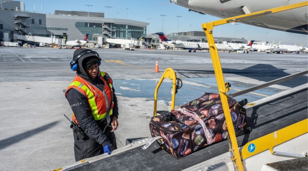 A ramp agent loads bags into a plane’s cargo hold at LaGuardia Airport in New York, Jan. 23, 2025. The number of bags that can fit depends on the type of plane and on stacking strategy, like a game of Tetris. (Graham Dickie/The New York Times)