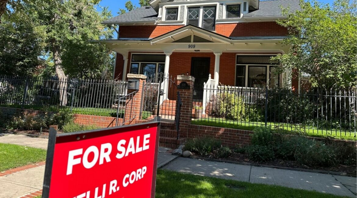 A for sale sign stands outside a home on the market in the Alamo Placita neighborhood Tuesday, Aug. 27, 2024, in central Denver. (AP File)