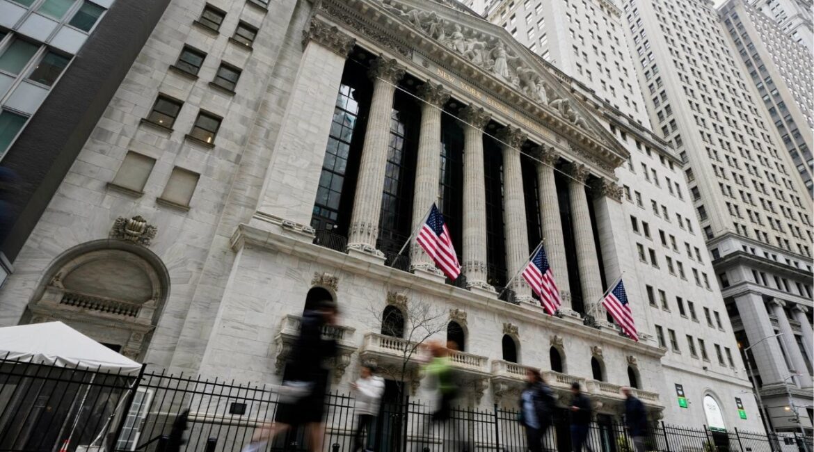 People walk by the New York Stock Exchange, Thursday morning, April 10, 2025. (AP/Richard Drew)