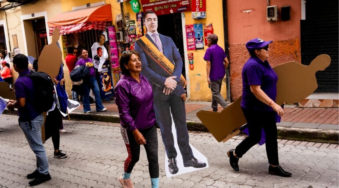 Supporters of President Daniel Noboa with cutouts of him in a suit and a presidential sash in Quito, the Ecuadorean capital, Feb. 5, 2025. Ecuador holds a runoff presidential election on Sunday, April 13, 2025, and the race is in a dead heat as voters decide which candidate can better address the violence that drug trafficking has unleashed on the country. (Johanna Alarcon/The New York Times)