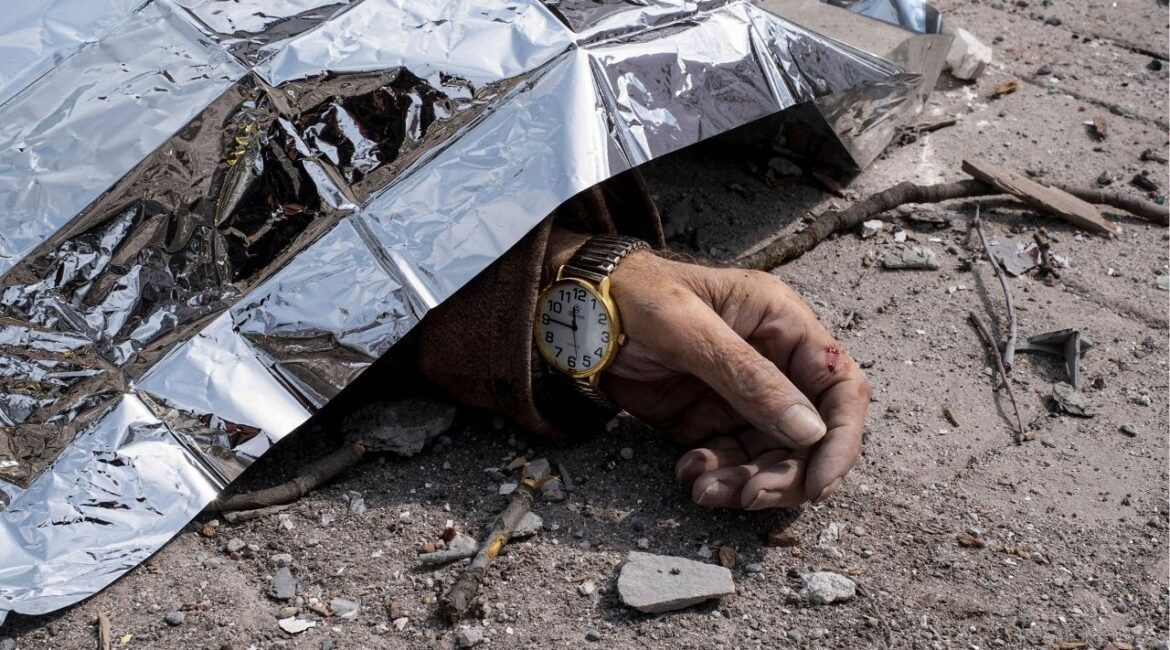 A dead body lies on the ground after a Russian missile strike on Sumy, Ukraine, Sunday April 13, 2025. (AP/Volodymyr Hordiienko)