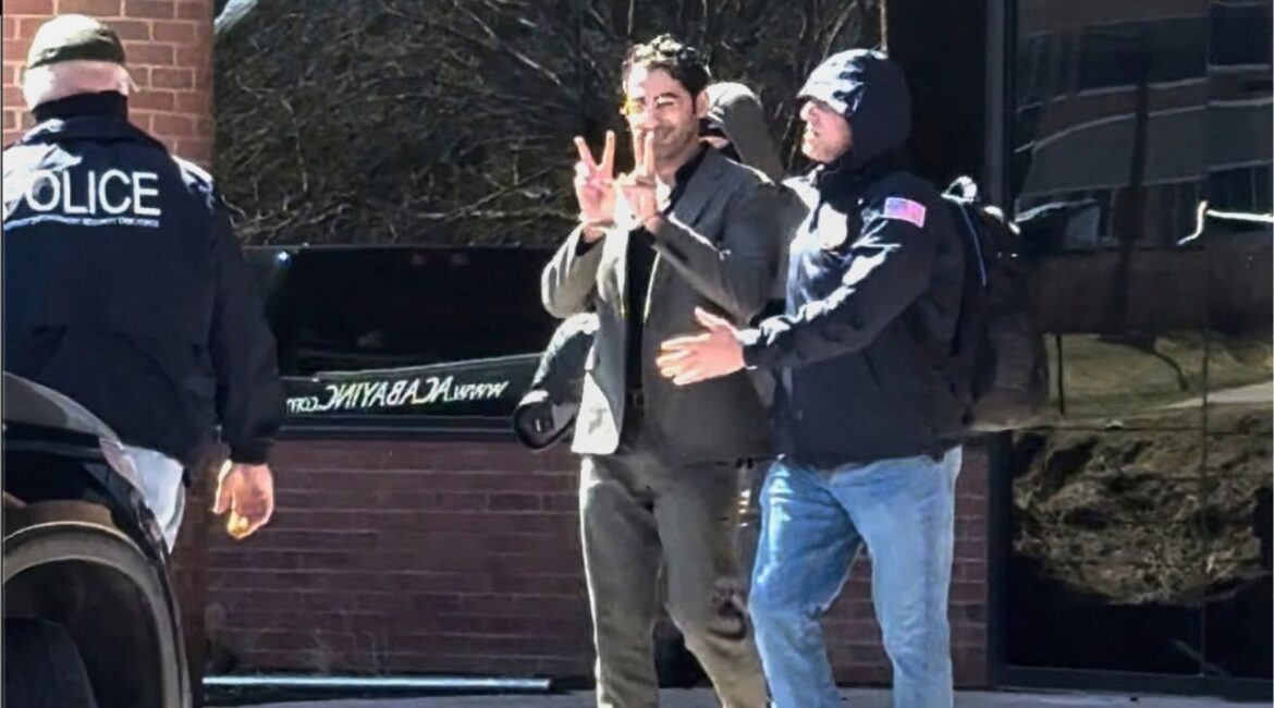 This image taken from a video provided by Christopher Helali shows Mohsen Mahdawi, a Palestinian man who led protests against the war in Gaza as a student at Columbia University, being detained at the U.S. Citizenship and Immigration Services office in Colchester, Vt., on Monday, April 14, 2025. (Christopher Helali via AP)
