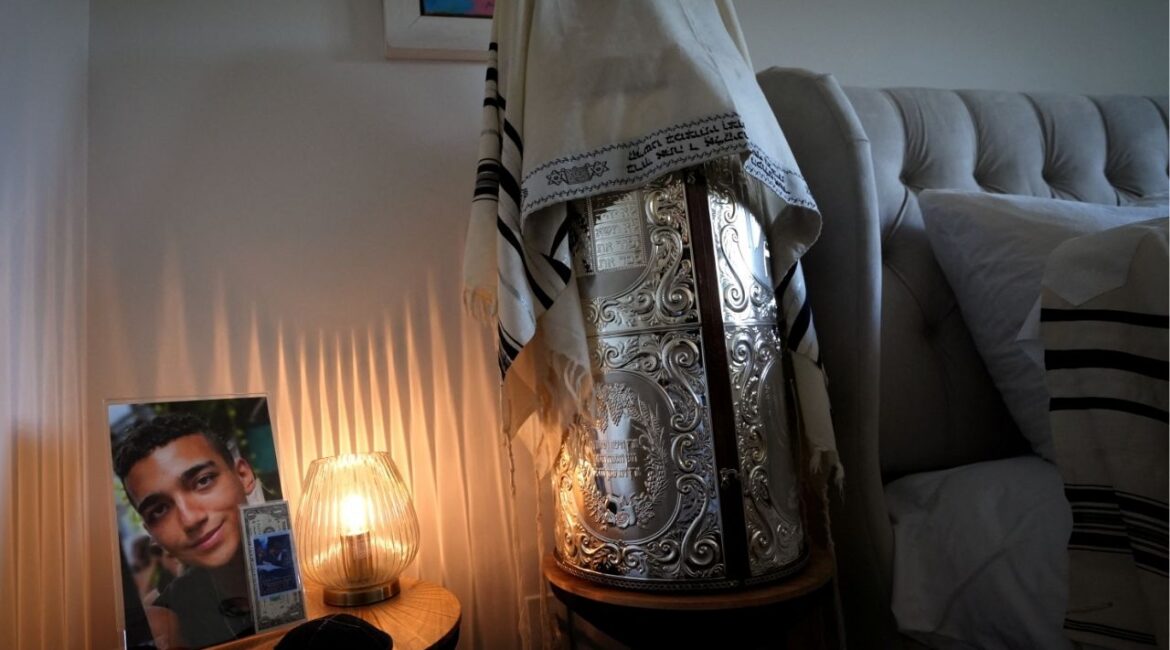 A Torah and A photograph of Edan Alexander, the American-Israeli and Israel Defense Forces soldier taken hostage during the October 7, 2023 attack on Israel by Hamas, sit in his home during a family interview with Reuters in Tenafly, New Jersey, U.S., December 14, 2024. (REUTERS File)