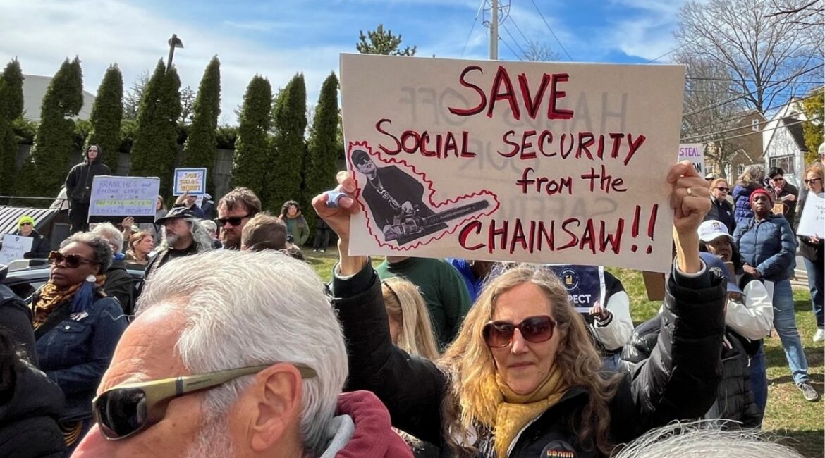 A woman holds a sign during a protest against cuts made by U.S. President Donald Trump's administration to the Social Security Administration, in White Plains, New York, U.S., March 22, 2025. (REUTERS File)