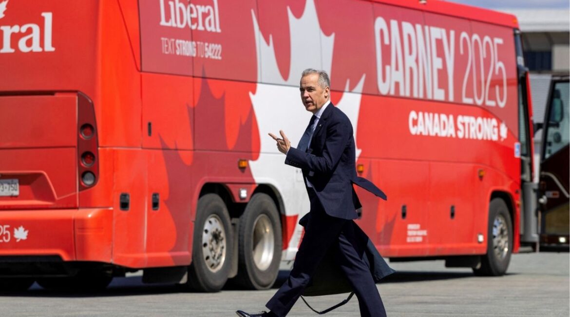 Canada's Prime Minister Mark Carney walks towards his bus after getting off his plane in Halifax Stanfield International Airport during his Liberal Party election campaign tour in Goffs, Nova Scotia, Canada April 21, 2025. (REUTERS/Carlos Osorio)
