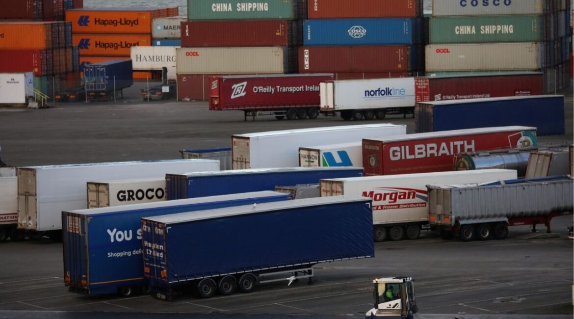 A port vehicle drives past trailers and shipping containers at the Port of Belfast, Northern Ireland January 2, 2021. REUTERS/Phil Noble