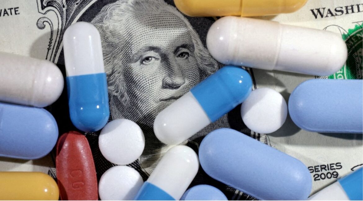 U.S. dollar banknote and medicines are seen in this illustration taken, June 27, 2024. (REUTERS/Dado Ruvic/Illustration//File Photo)