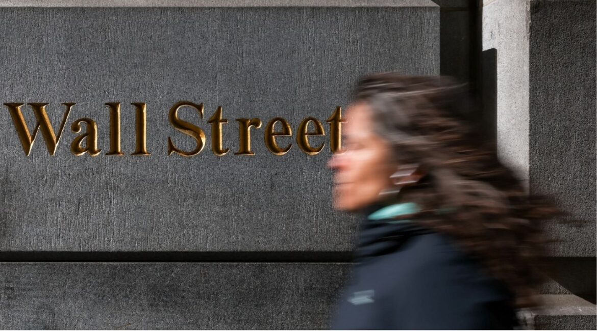 A woman walks down Wall Street in New York City, U.S., April 8, 2025. (REUTERS/Kylie Cooper)