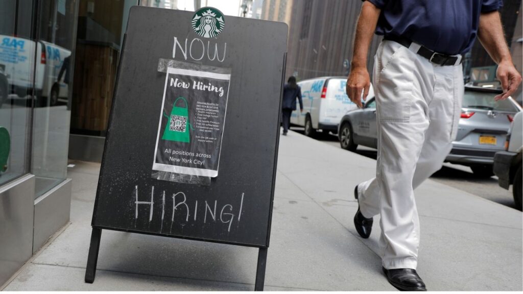 A sign advertising job openings is seen outside of a Starbucks in Manhattan, New York City, New York, U.S., May 26, 2021. (REUTERS/Andrew Kelly/File photo)