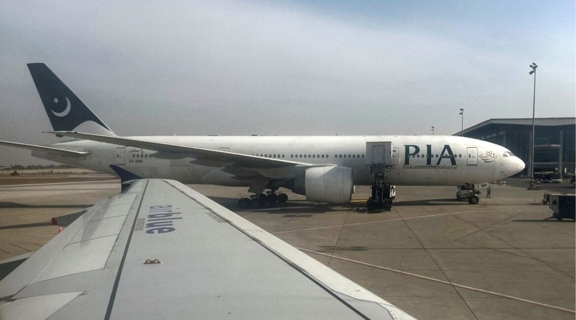 Pakistan International Airlines (PIA) passenger plane sits on tarmac, as seen through a plane window, at the Islamabad International Airport, Islamabad, Pakistan October 27, 2024. (REUTERS/Akhtar Soomro//File Photo)