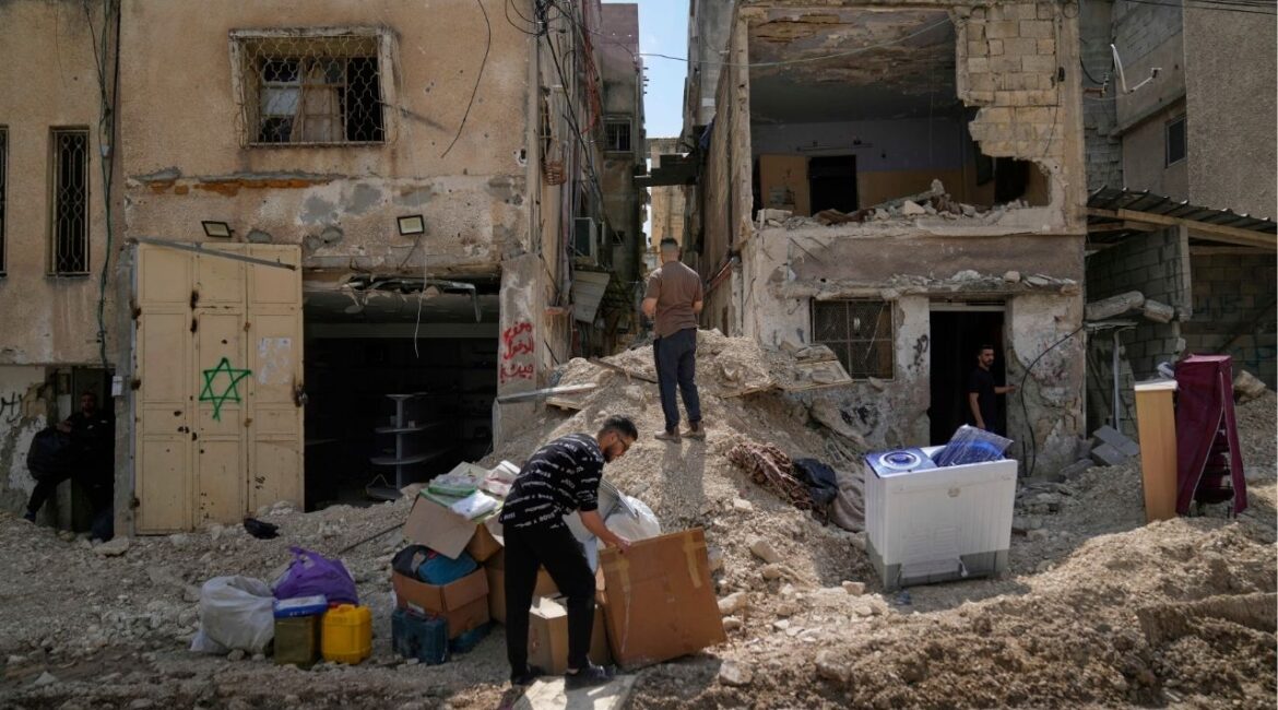 Residents of the now evacuated Palestinian refugee camp of Tulkarem return to collect belongings before the destruction of their homes as Israeli forces prepare to carry out the demolition of 116 homes across the two refugee camps of the Israeli occupied West Bank city of Tulkarem, Friday, May 2, 2025. (AP/Nasser Nasser)