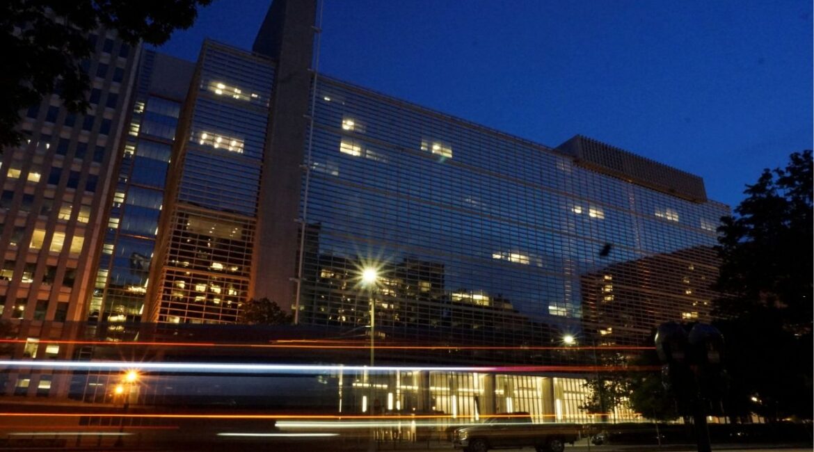 Vehicles pass in front of the World Bank building, which houses the International Centre for Settlement of Investment Disputes, in Washington, D.C. on May 20, 2022. Picture taken with a long exposure. Picture taken May 20, 2022. (REUTERS/Raphael Satter/File Photo)