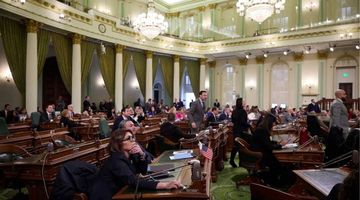 Assemblymembers watch the results of a vote during an Assembly floor session at the state Capitol in Sacramento on March 13, 2025. Photo by Fred Greaves for CalMatters