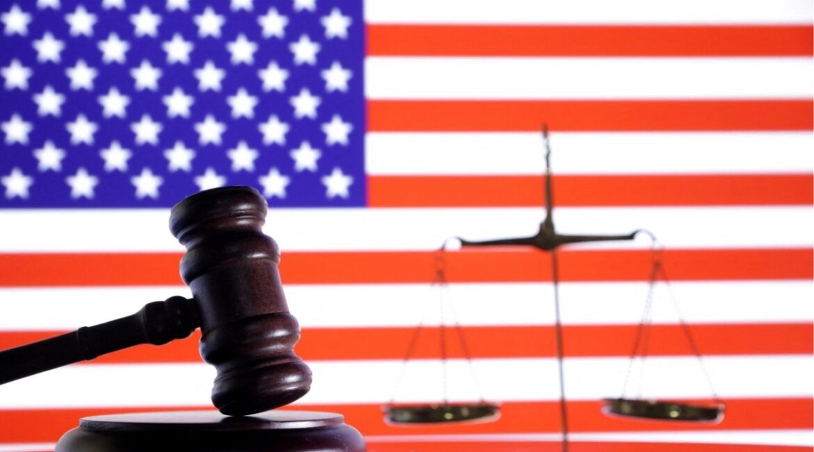 The U.S. flag, a judge gavel and a vintage scale are seen in this illustration taken August 6, 2024. (REUTERS/Dado Ruvic/Illustration)