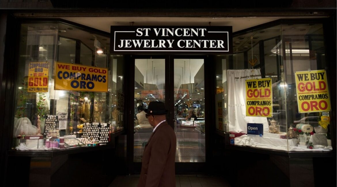 A pedestrian walks past the St. Vincent Jewelry Center in the Jewelry District of Los Angeles, Friday, May 2, 2025. (AP Photo/Jae C. Hong)