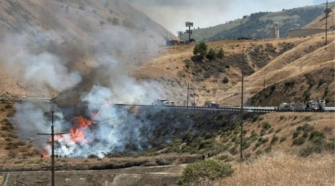 A fire has shut down all southbound lanes of I-5 at Grapevine Road on Monday, May 12, 2025, prompting major traffic delays as crews work to extinguish the flames. (CHP)