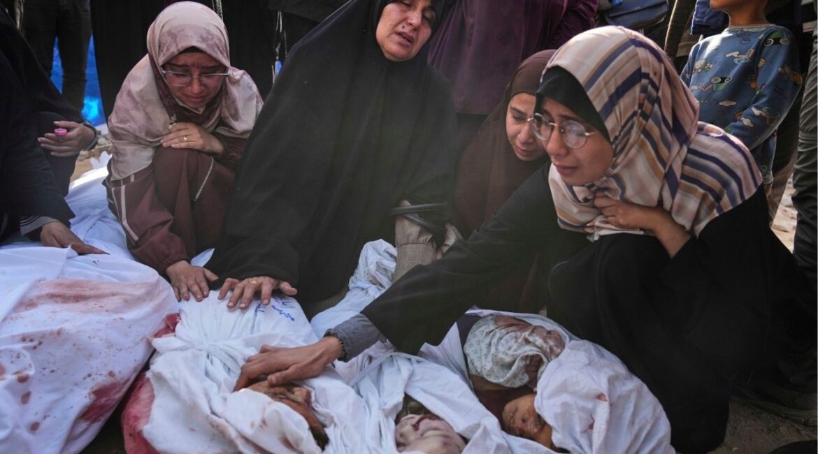 Palestinians mourn children from their families who were killed in Israeli airstrikes in Jabalia, in the northern Gaza Strip, on Wednesday, May 14, 2025. According to local hospitals, the strikes killed 48 people, including 22 children. (AP Photo/Jehad Alshrafi)
