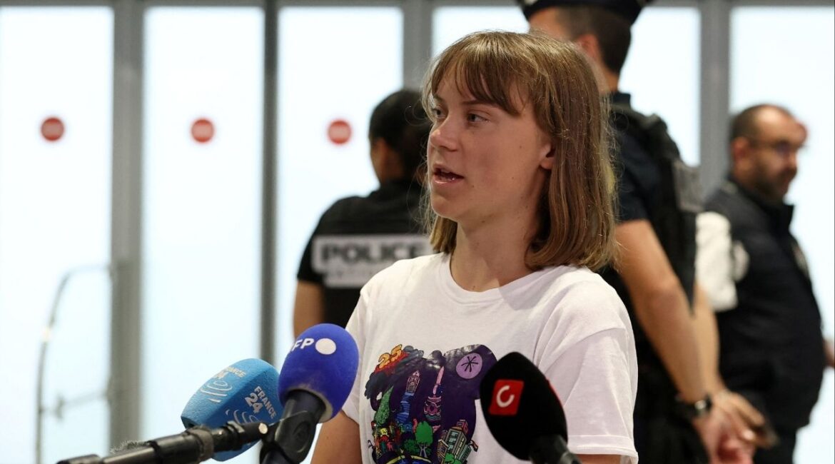 Swedish activist Greta Thunberg, who departed Israel by plane on Tuesday after being detained aboard the Gaza-bound British-flagged yacht "Madleen" after Israeli forces boarded the charity vessel as it attempted to reach the Gaza Strip in defiance of an Israeli naval blockade, talks to journalists as she arrives at a terminal at the Paris-Charles de Gaulle Airport, in Roissy-en-France near Paris, France, June 10, 2025. REUTERS/Gonzalo Fuentes