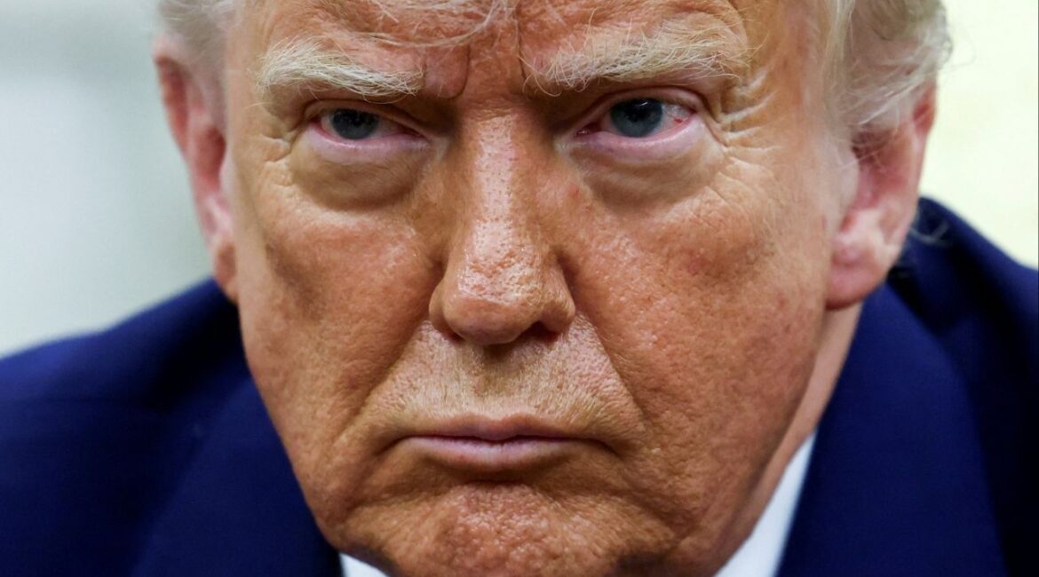President Donald Trump looks on as he meets South African President Cyril Ramaphosa in the Oval Office of the White House in Washington, D.C., U.S., May 21, 2025. REUTERS/Kevin Lamarque/File Phot