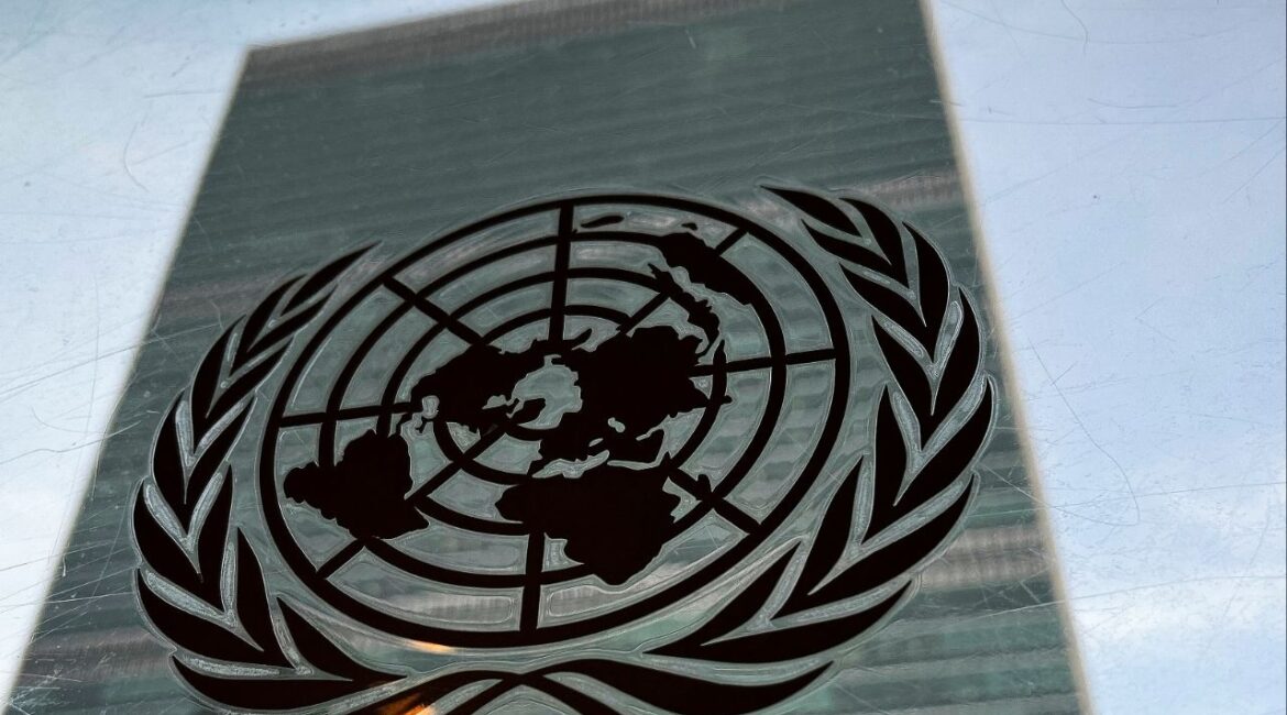 The United Nations headquarters building is pictured with a UN logo in the Manhattan borough of New York City, New York, U.S., March 1, 2022. REUTERS/Carlo Allegri/ File Photo