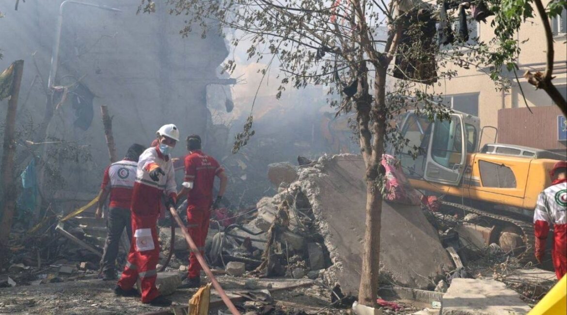 Rescuers work at the site of a damaged building, in the aftermath of Israeli strikes, in Tehran, Iran, June 13, 2025. Iranian Red Crescent Society/WANA (West Asia News Agency)/Handout via REUTERS