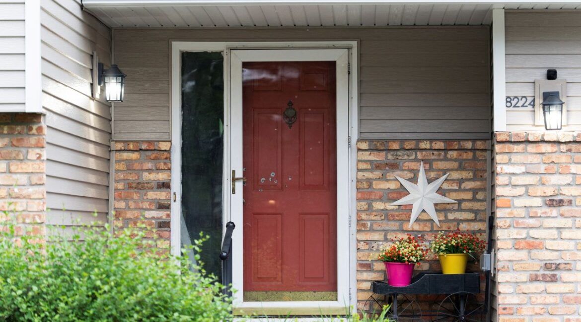 Bullet holes mark the front door of Minnesota state Senator John Hoffman, who was shot alongside his wife, Yvette, in what is believed to be an attack by 57-year-old suspect Vance Luther Boelter, who is also the lead suspect in the shooting deaths of senior Democratic state assemblywoman Melissa Hortman and her husband, Marc, in Champlin, Minnesota, U.S., June 14, 2025. REUTERS/Tim Evans