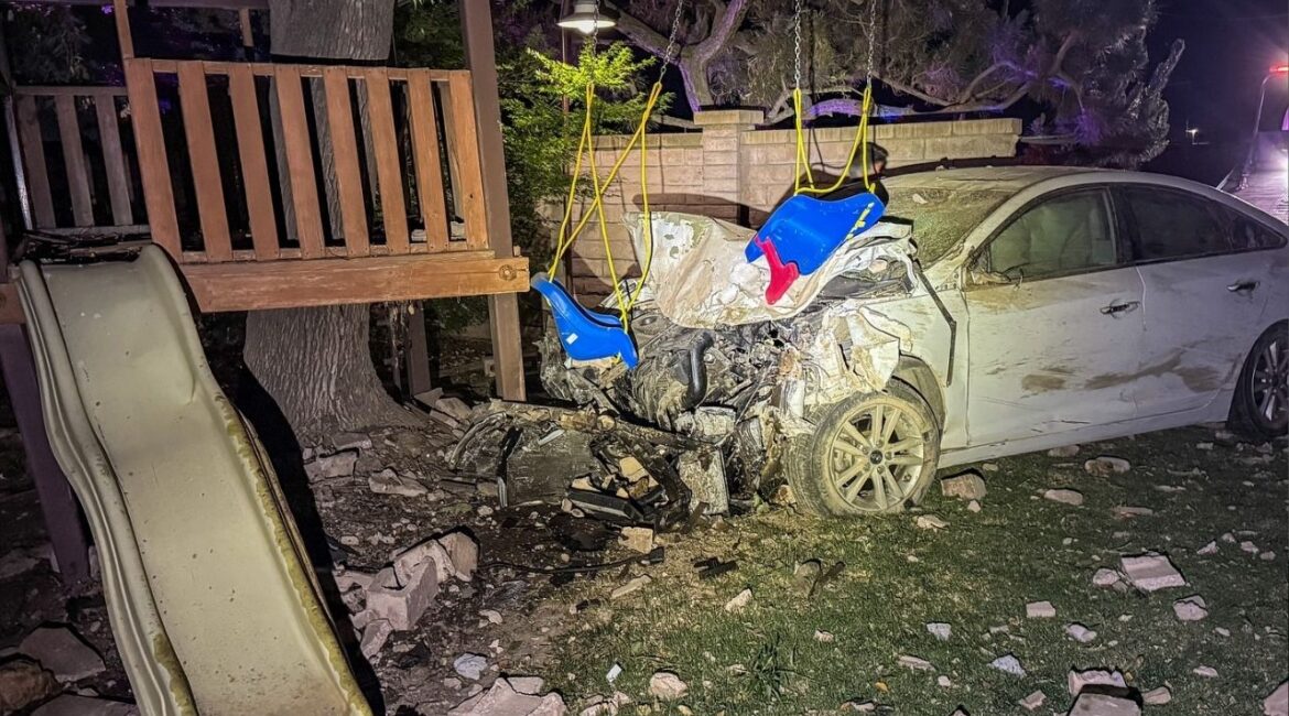A suspected DUI driver crashed through a backyard wall and stopped near a children’s play structure before falling asleep on a patrol car. (CHP)