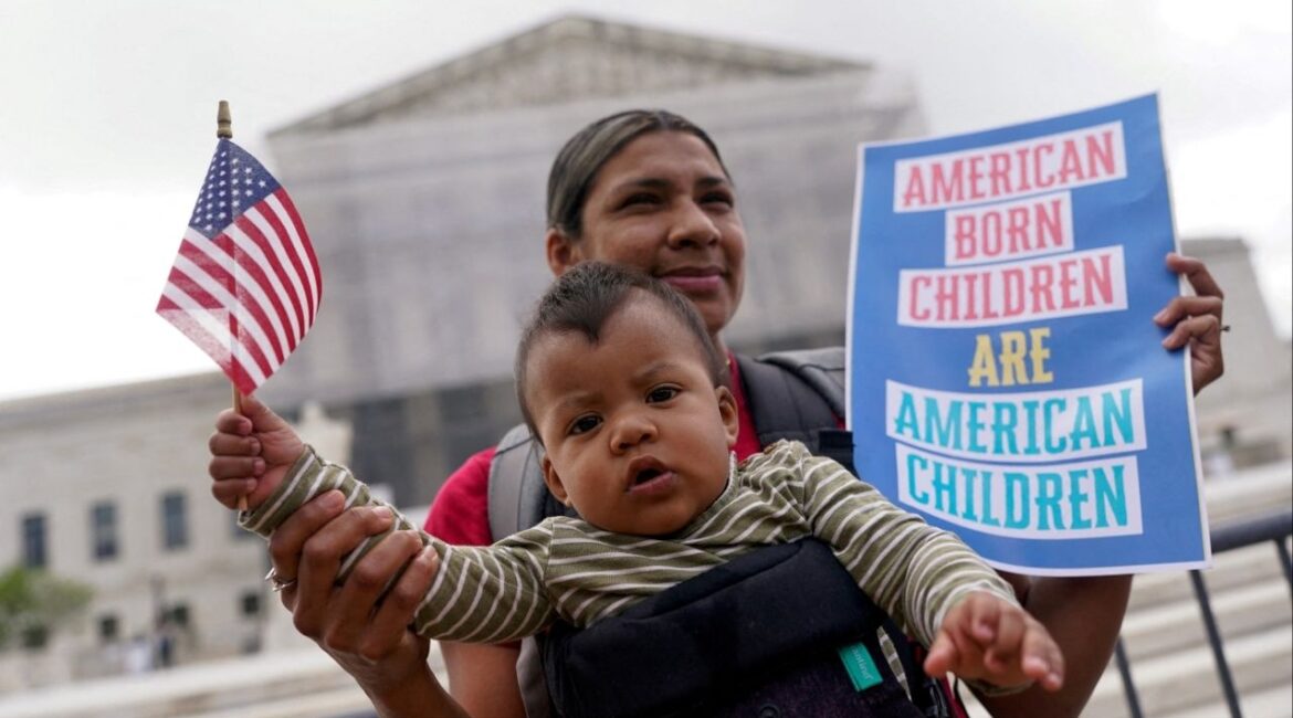 Olga Urbina carries baby Ares Webster as demonstrators rally on the day the Supreme Court justices hear oral arguments over U.S. President Donald Trump's bid to broadly enforce his executive order to restrict automatic birthright citizenship, during a protest outside the U.S. Supreme Court in Washington, D.C., U.S., May 15, 2025. (Reuters File)