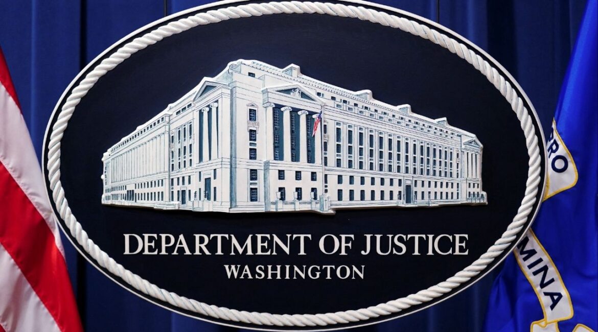 A U.S. Justice Department logo or seal showing Justice Department headquarters, known as "Main Justice," is seen behind the podium in the Department's headquarters briefing room before a news conference with the Attorney General in Washington, January 24, 2023. (Reuters File)