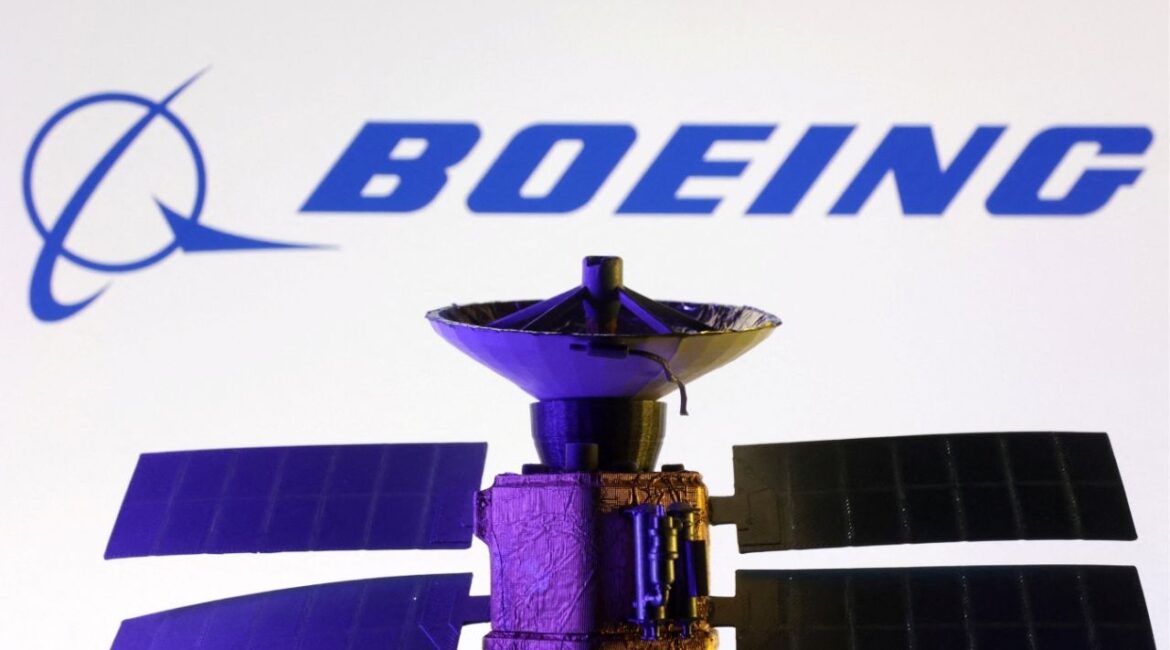 Boeing logo and miniature satellite model are seen in this illustration taken, March 10, 2025. (Reuters File)