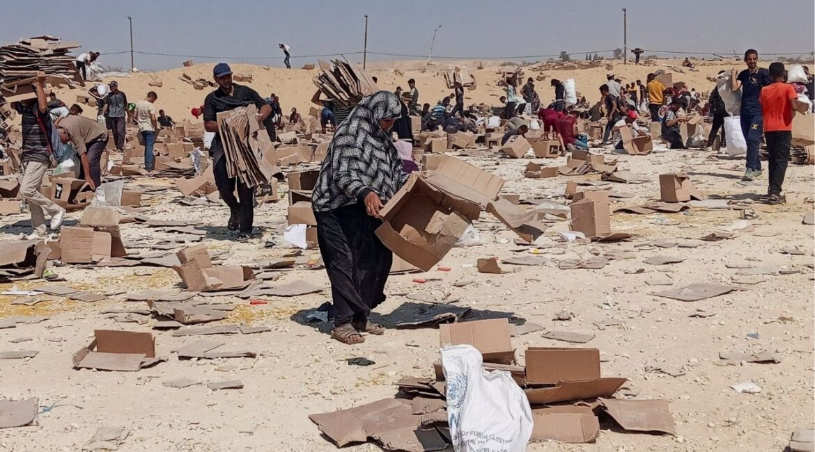 Palestinians gather to collect what remains of relief supplies from the distribution center of the U.S.-backed Gaza Humanitarian Foundation, in Rafah, in the southern Gaza Strip, June 5, 2025. (Reuters File)