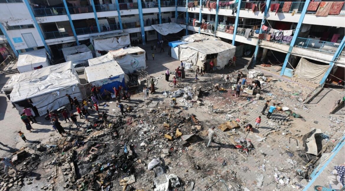 Palestinians inspect the site of an overnight Israeli strike on a school sheltering displaced people, in Bureij refugee camp, in the central Gaza Strip, July 8, 2025. (Reuters/Ramadan Abed)