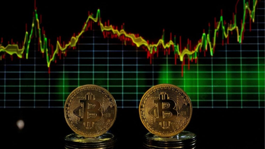 Bitcoin tokens and a price chart are seen in this illustration picture taken November 21, 2024. (Reuters File)