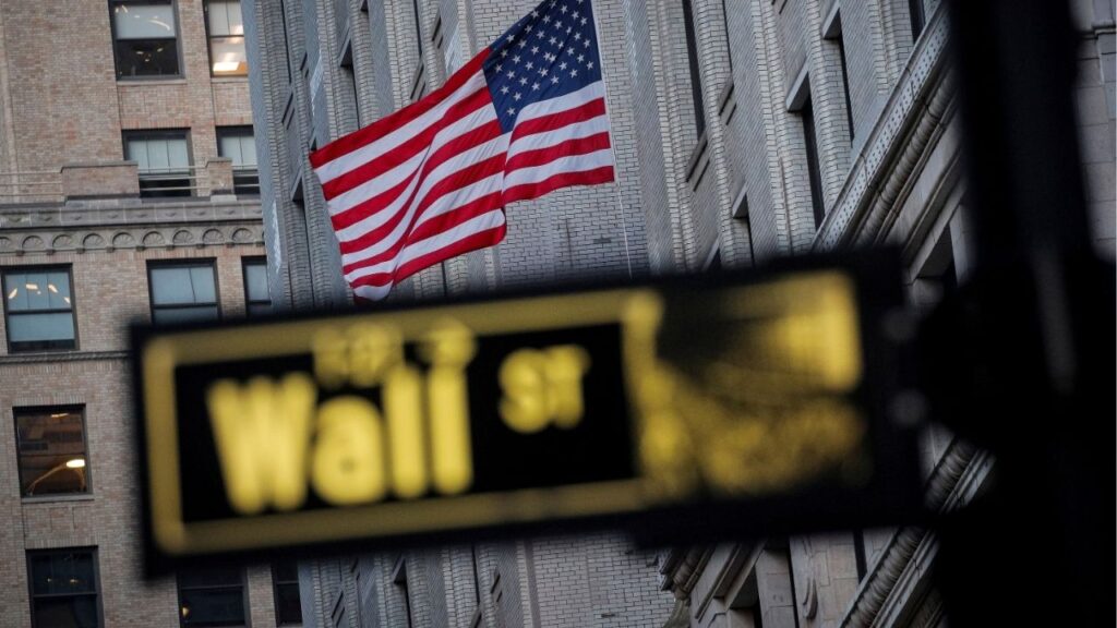 The U.S. flag is seen on a building on Wall St. in the financial district in New York, U.S., November 24, 2020. (Reuters File)