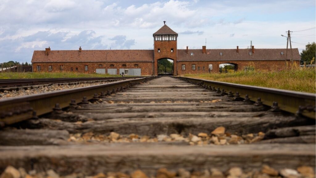Kyle Langford, a Republican candidate for California governor, is facing widespread backlash after posting a photo of himself at Auschwitz with the caption “My 0% Unemployment Plan,” a message Holocaust memorial have condemned as deeply offensive. (Shutterstock)