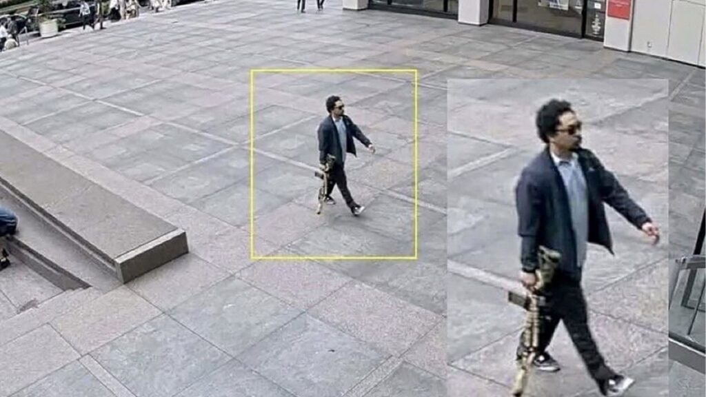 A man holding a rifle walks into an office building at 345 Park Avenue shortly before a shooting that killed several people, in the Midtown Manhattan district of New York City, U.S. July 28, 2025, in a still image taken from surveillance video. Surveillance Camera/Handout via REUTERS