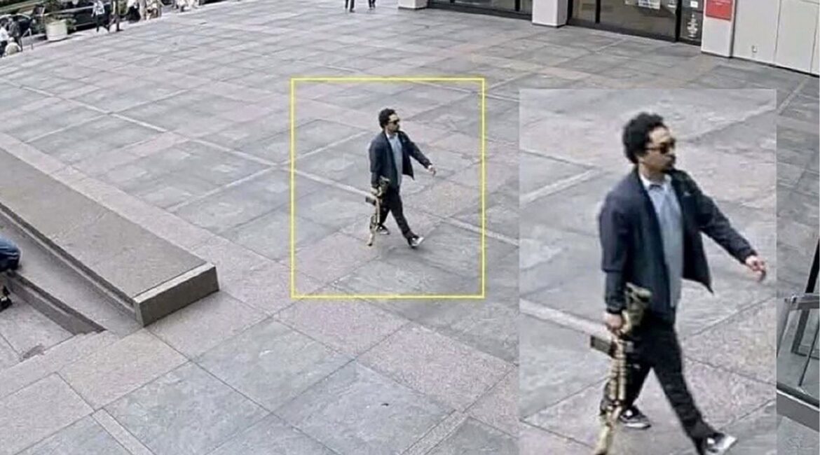 A man holding a rifle walks into an office building at 345 Park Avenue shortly before a shooting that killed several people, in the Midtown Manhattan district of New York City, U.S. July 28, 2025, in a still image taken from surveillance video. Surveillance Camera/Handout via REUTERS