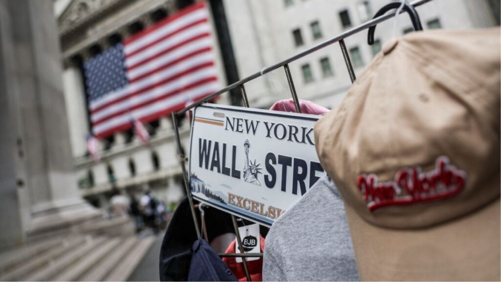 A Wall Street plate is seen on a street vendor stall outside the New York Stock Exchange (NYSE) in New York City, U.S., July 11, 2025. (Reuters/Jeenah Moon)