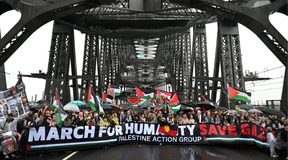 Protesters walk across the Sydney Harbour Bridge during the Palestine Action Group's March for Humanity in Sydney, Australia, August 3, 2025. AAP/Dean Lewins via REUTERS