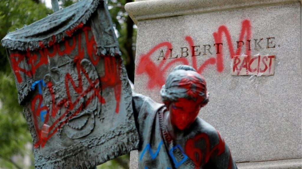 Messages of protest remain after protesters toppled the statue of Albert Pike, amid a series of racial inequality protests, at the Brigadier General Albert Pike Statue site near Capitol Hill in Washington, U.S., July 7, 2020. (Reuters File)