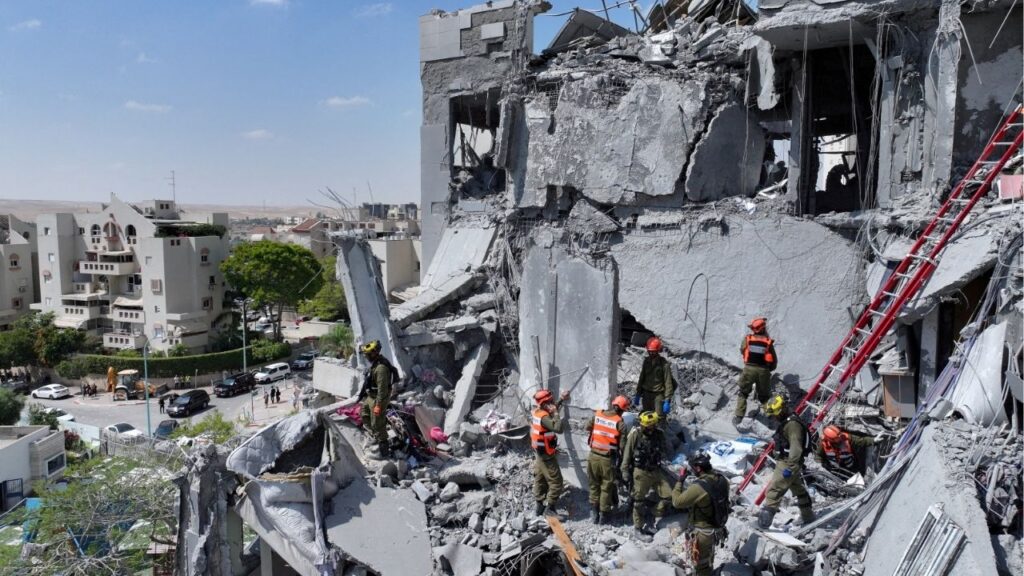 A drone view shows emergency personnel working at an impacted residential site, following an early morning missile attack from Iran on Israel, in Be'er Sheva, Israel June 24, 2025. (Reuters File)