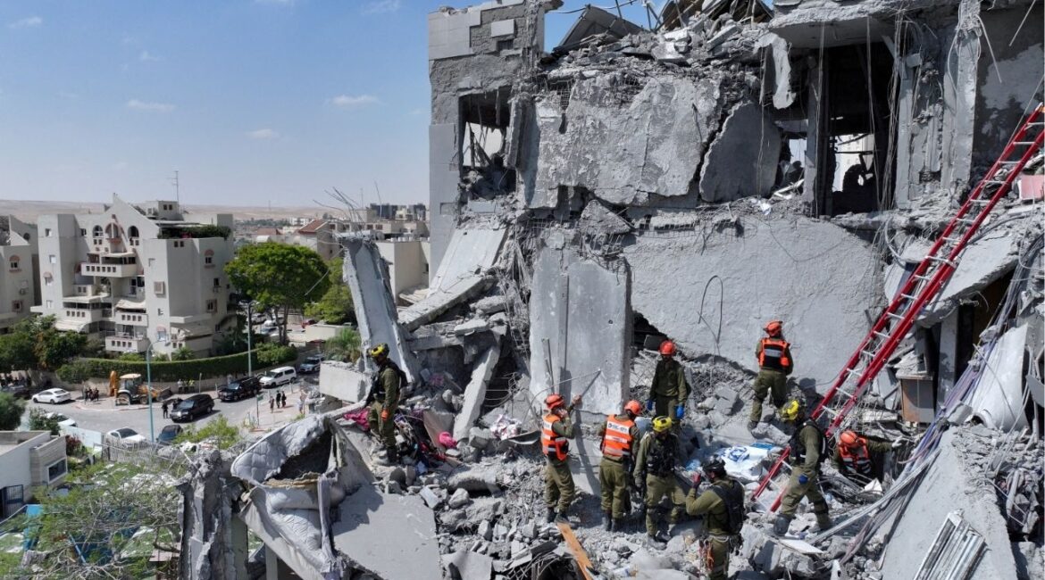 A drone view shows emergency personnel working at an impacted residential site, following an early morning missile attack from Iran on Israel, in Be'er Sheva, Israel June 24, 2025. (Reuters File)
