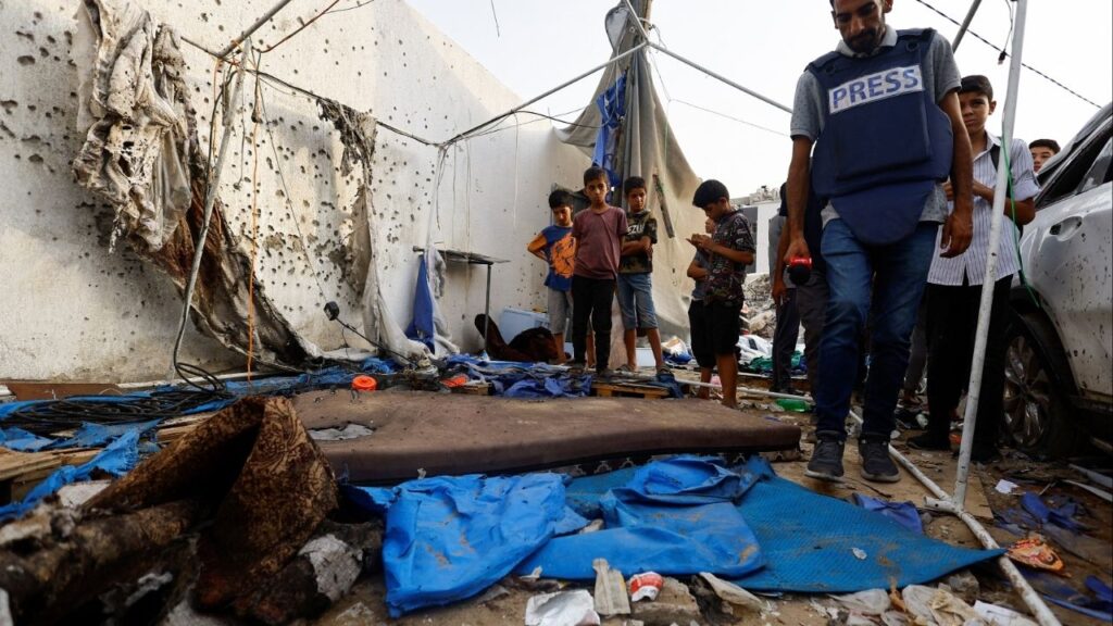 A member of the media inspects the damage at the site of an Israeli strike on a tent near Shifa Hospital, in Gaza City August 11, 2025. (Reuters File)