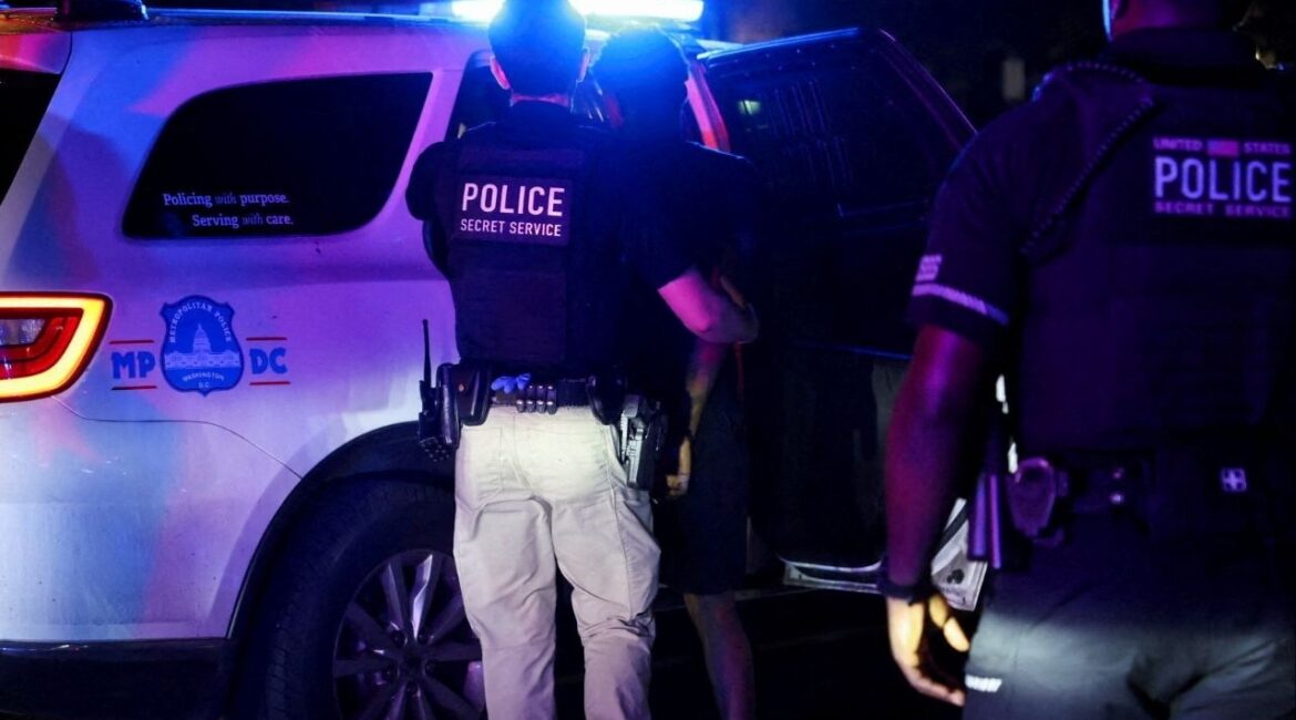 Police detain a person in the Brightwood neighborhood after U.S. President Donald Trump's announcement of the federal takeover of the Metropolitan Police Department under the Home Rule Act and the deployment of the National Guard to assist in crime prevention in the nation's capital, in Washington, D.C., U.S., August 14, 2025. (Reuters File)