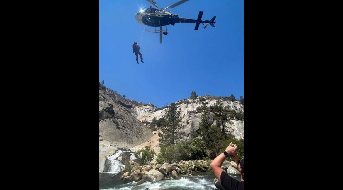 In an image from the Tulare County Sheriff’s Office, Ryan Wardwell stands trapped at the Seven Teacups waterfalls in the Sequoia National Forest on Tuesday, Aug. 12, 2025. Wardwell, who was found with minor injuries and suffering from dehydration, was located by rescue crews operating a drone near where he had last been spotted. (Tulare County Sheriff’s Office via The New York Times) In an image from the Tulare County Sheriff’s Office, a California Highway Patrol helicopter hovers over a waterfall where a man was trapped at the Seven Teacups waterfalls in the Sequoia National Forest on Tuesday, Aug. 12, 2025. The man, who was found with minor injuries and suffering from dehydration, was located by rescue crews operating a drone near where he had last been spotted. (Tulare County Sheriff’s Office via The New York Times)