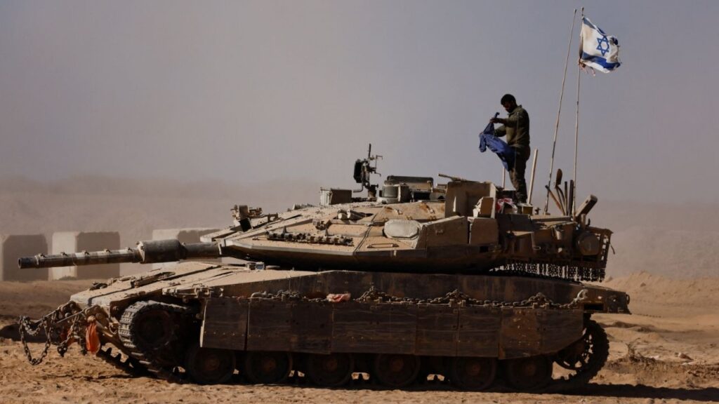 An Israeli soldier stands on a tank on the Israeli side of the border with Gaza, Israel August 20, 2025. (Reuters/Amir Cohen)