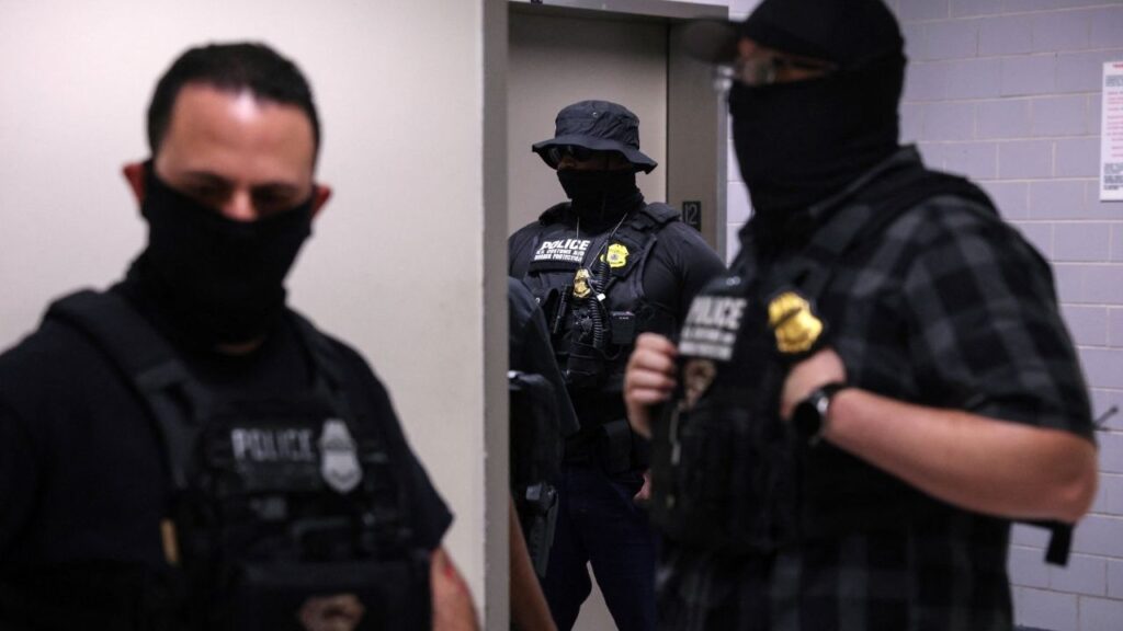 Federal immigration officers stand with masks, as federal detainments continue, in the hallways of U.S. immigration court in New York City, U.S., August 19, 2025. (Reuters File)